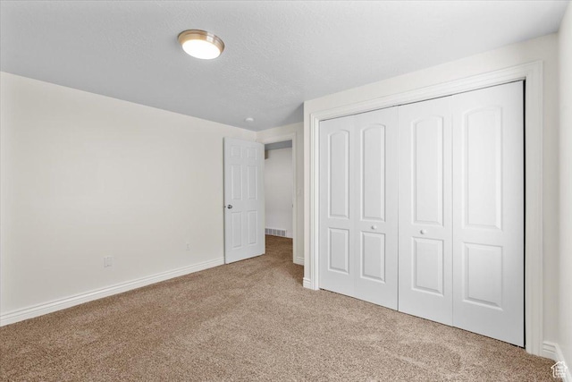 6515 S Mount Whitney Ln, West Valley City, UT 84118 - unfurnished bedroom with carpet flooring, a closet, and a textured ceiling