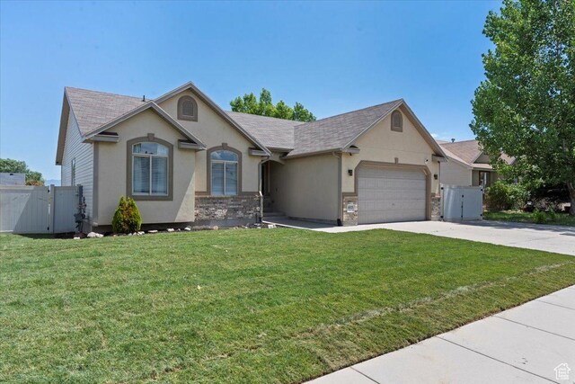 6515 S Mount Whitney Ln, West Valley City, UT 84118 - ranch-style home with a gate, concrete driveway, an attached garage, and stucco siding