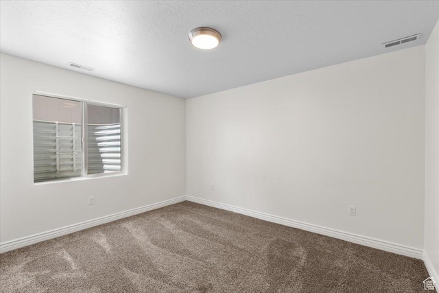 6515 S Mount Whitney Ln, West Valley City, UT 84118 - carpeted empty room featuring baseboards and a textured ceiling