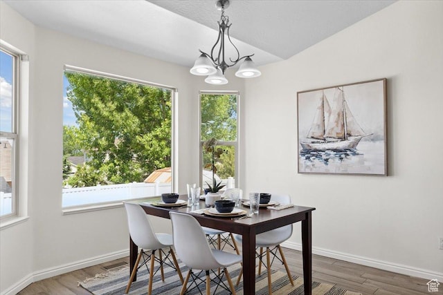 6515 S Mount Whitney Ln, West Valley City, UT 84118 - dining space featuring a chandelier and wood finished floors