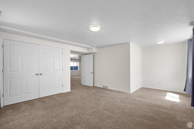 6515 S Mount Whitney Ln, West Valley City, UT 84118 - basement featuring carpet floors and a textured ceiling