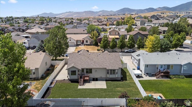 6515 S Mount Whitney Ln, West Valley City, UT 84118 - aerial perspective of suburban area with a mountainous background