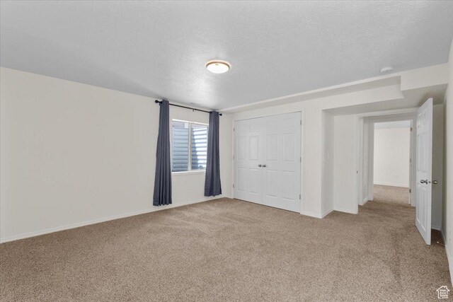 6515 S Mount Whitney Ln, West Valley City, UT 84118 - unfurnished bedroom with carpet, a textured ceiling, and a closet