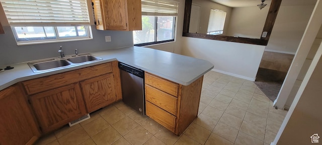 1226 N 450 W, Sunset, UT 84015 - kitchen featuring stainless steel dishwasher, a peninsula, brown cabinets, light countertops, and light tile patterned floors