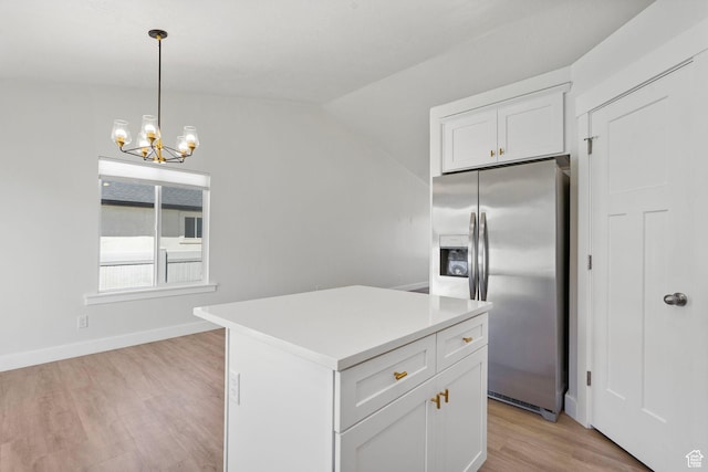 2362 E Quaking Aspen Ln, Eagle Mountain, UT 84005 - kitchen with stainless steel fridge with ice dispenser, light wood finished floors, white cabinetry, a chandelier, and light countertops