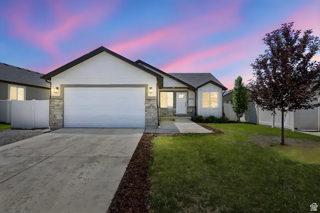 2362 E Quaking Aspen Ln, Eagle Mountain, UT 84005 - ranch-style house featuring driveway, an attached garage, stone siding, and board and batten siding