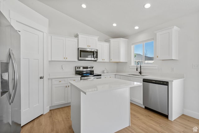 2362 E Quaking Aspen Ln, Eagle Mountain, UT 84005 - kitchen featuring appliances with stainless steel finishes, white cabinets, lofted ceiling, recessed lighting, and light countertops