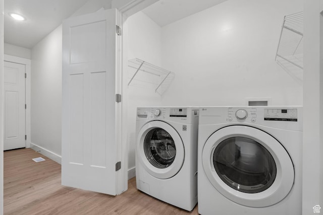 2362 E Quaking Aspen Ln, Eagle Mountain, UT 84005 - laundry room with independent washer and dryer, light wood-type flooring, and recessed lighting