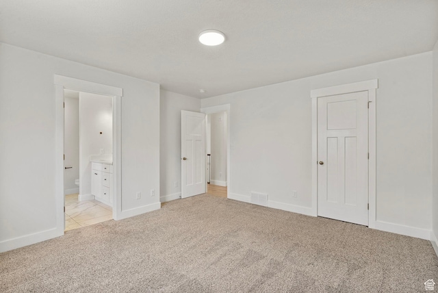 2362 E Quaking Aspen Ln, Eagle Mountain, UT 84005 - unfurnished bedroom with light carpet and connected bathroom