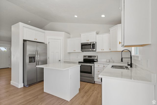 2362 E Quaking Aspen Ln, Eagle Mountain, UT 84005 - kitchen featuring stainless steel appliances, vaulted ceiling, a center island, white cabinets, and light countertops