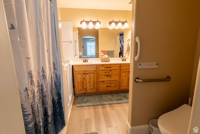 594 W 5450 S, Riverdale, UT 84405 - bathroom with wood finished floors, double vanity, and curtained shower
