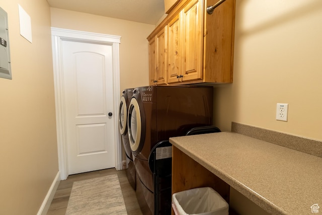 594 W 5450 S, Riverdale, UT 84405 - laundry room with washing machine and dryer, cabinet space, electric panel, and light wood-style floors