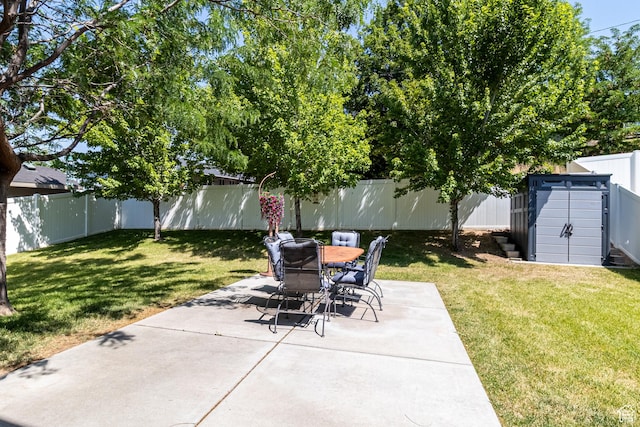 594 W 5450 S, Riverdale, UT 84405 - fenced backyard featuring a patio, a storage shed, and outdoor dining area