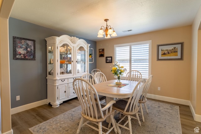 594 W 5450 S, Riverdale, UT 84405 - dining room featuring wood finished floors and a chandelier