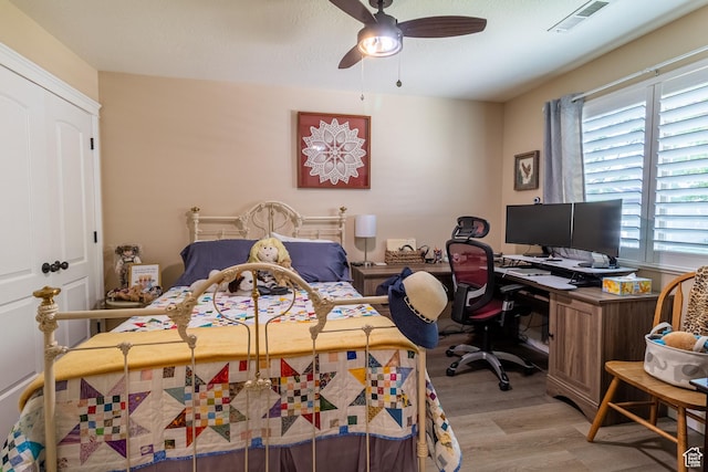 594 W 5450 S, Riverdale, UT 84405 - bedroom with light wood-style flooring, a desk, and a ceiling fan