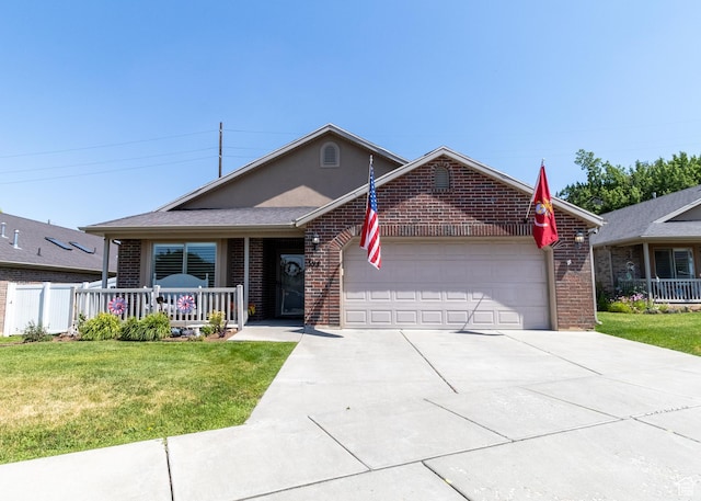 594 W 5450 S, Riverdale, UT 84405 - ranch-style home featuring brick siding, a front yard, a garage, covered porch, and concrete driveway