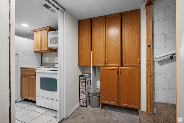 717 E 150 S, Provo, UT 84606 - kitchen featuring white appliances, concrete floors, brown cabinetry, and light countertops