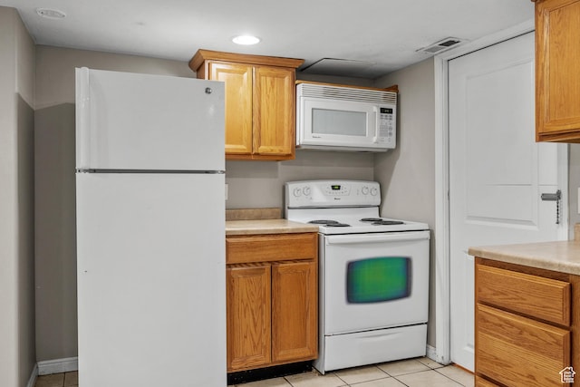 717 E 150 S, Provo, UT 84606 - kitchen featuring white appliances, light tile patterned floors, light countertops, recessed lighting, and brown cabinetry