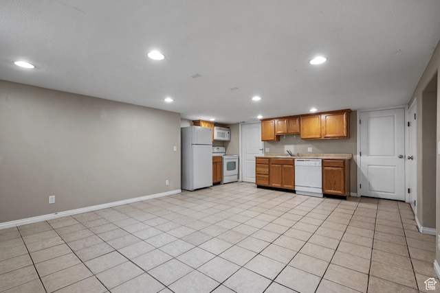 717 E 150 S, Provo, UT 84606 - kitchen with white appliances, light countertops, recessed lighting, and brown cabinetry