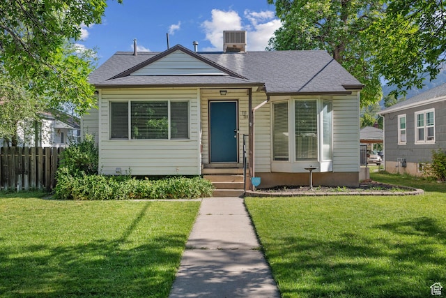 717 E 150 S, Provo, UT 84606 - bungalow-style home with entry steps, a shingled roof, and a chimney