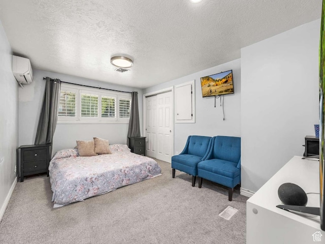 211 N 800 E, Bountiful, UT 84010 - bedroom with a wall mounted AC, carpet flooring, a textured ceiling, and a closet