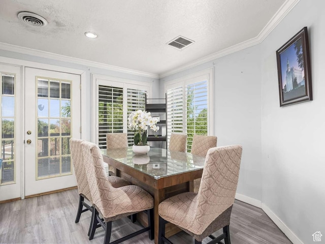 211 N 800 E, Bountiful, UT 84010 - dining room featuring wood finished floors, a textured ceiling, and crown molding