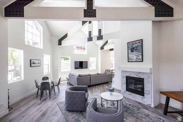 3302 Quarry Springs Dr, Park City, UT 84098 - living area with light wood-style flooring, high vaulted ceiling, a fireplace, and beamed ceiling