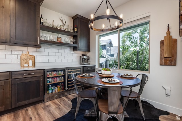 3302 Quarry Springs Dr, Park City, UT 84098 - dining room featuring wine cooler, a dry bar, a chandelier, and wood finished floors