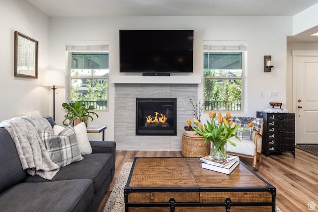 3302 Quarry Springs Dr, Park City, UT 84098 - living room featuring wood finished floors and a tiled fireplace
