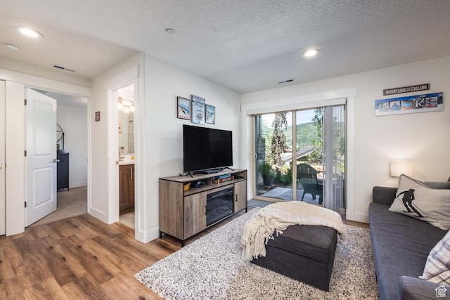 3302 Quarry Springs Dr, Park City, UT 84098 - living room with wood finished floors, recessed lighting, and a textured ceiling