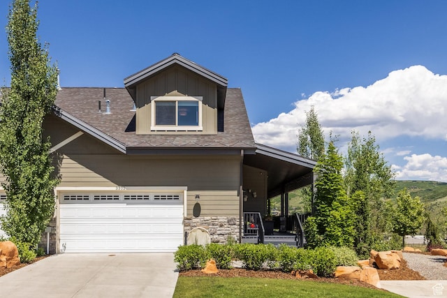 3302 Quarry Springs Dr, Park City, UT 84098 - view of front facade featuring a porch, concrete driveway, stone siding, and a shingled roof