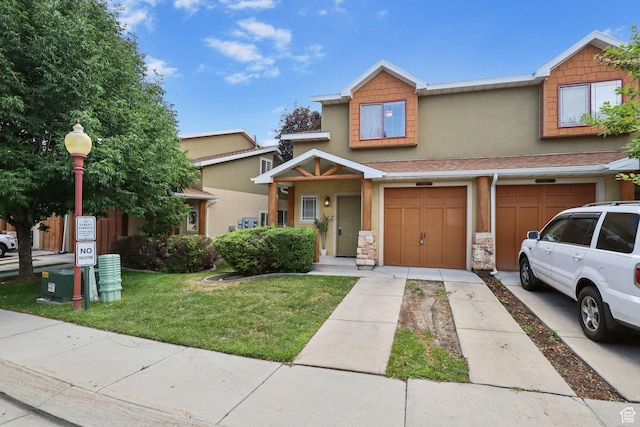 3901 W Pine Landing Way S, West Jordan, UT 84084 - view of property with driveway, stucco siding, a front lawn, and a garage