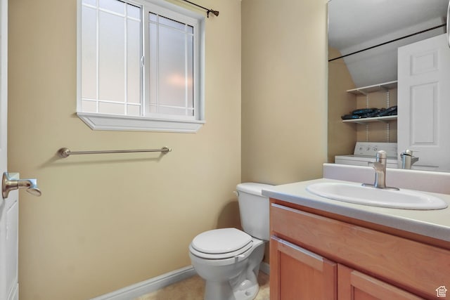 3901 W Pine Landing Way S, West Jordan, UT 84084 - bathroom featuring vanity, washer / clothes dryer, and tile patterned flooring