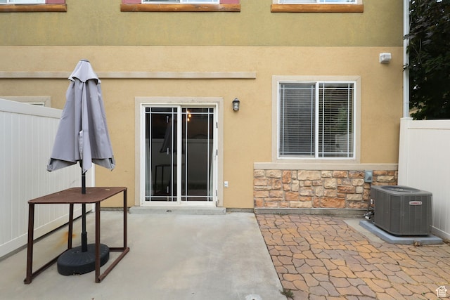 3901 W Pine Landing Way S, West Jordan, UT 84084 - property entrance featuring a patio, stone siding, and stucco siding
