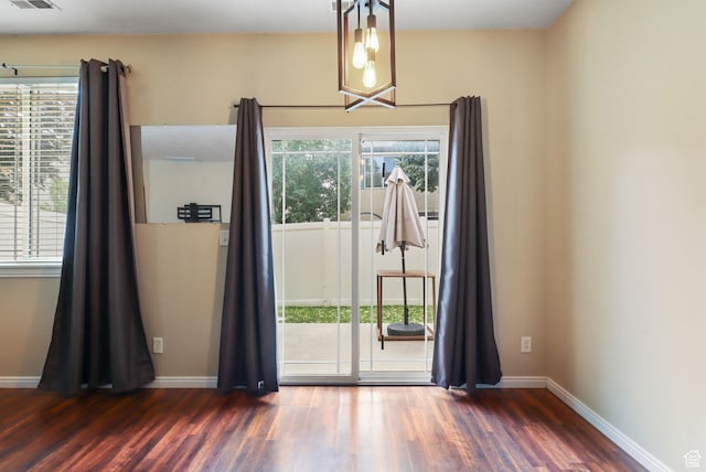 3901 W Pine Landing Way S, West Jordan, UT 84084 - spare room featuring a chandelier and wood finished floors