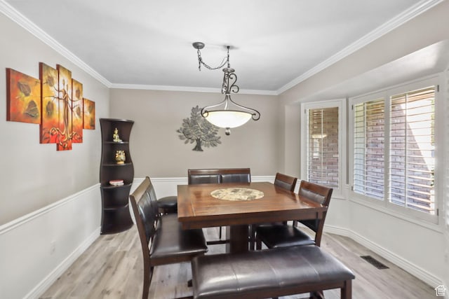 9618 S Ruskin Cir E, Sandy, UT 84092 - dining space with light wood-type flooring, plenty of natural light, and crown molding
