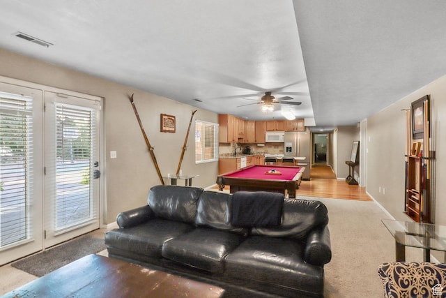 9618 S Ruskin Cir E, Sandy, UT 84092 - living area with billiards, a ceiling fan, and light colored carpet