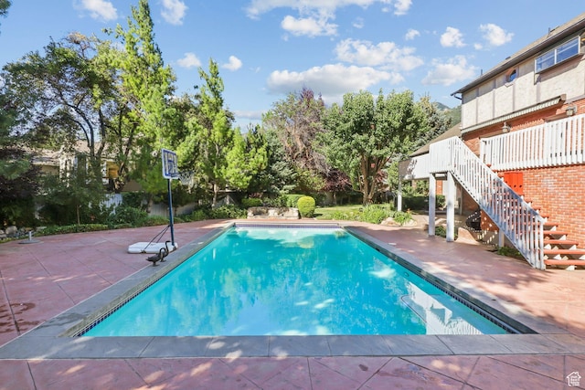 9618 S Ruskin Cir E, Sandy, UT 84092 - swimming pool featuring stairway and a patio area