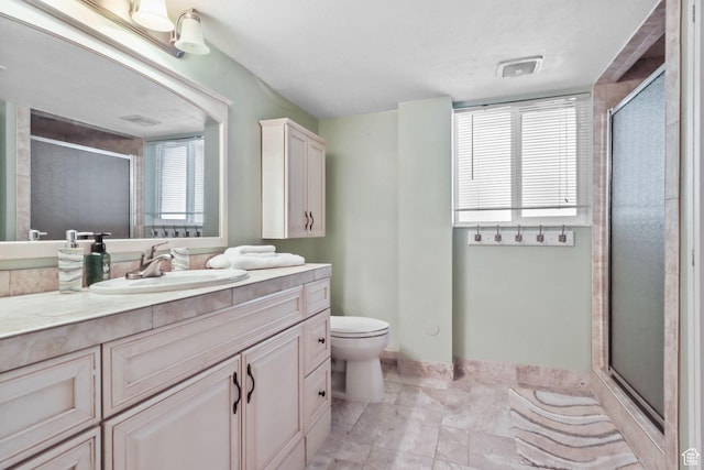 9618 S Ruskin Cir E, Sandy, UT 84092 - bathroom featuring vanity, a stall shower, and stone finish floors