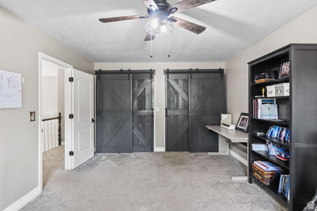 9618 S Ruskin Cir E, Sandy, UT 84092 - carpeted office with ceiling fan and a barn door