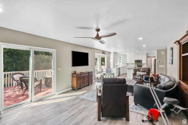 9618 S Ruskin Cir E, Sandy, UT 84092 - living area with plenty of natural light, ceiling fan, light wood-style floors, and recessed lighting