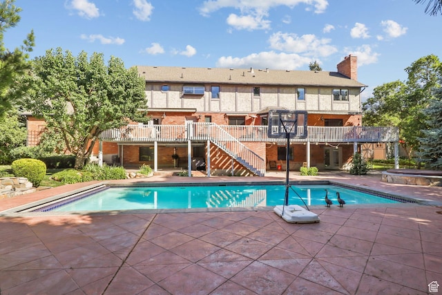 9618 S Ruskin Cir E, Sandy, UT 84092 - outdoor pool with stairs, a patio area, and a deck