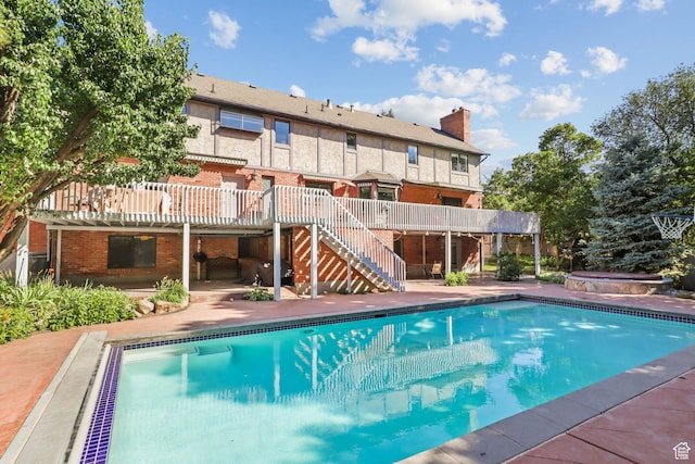 9618 S Ruskin Cir E, Sandy, UT 84092 - swimming pool with stairway, a deck, a patio, and a jacuzzi