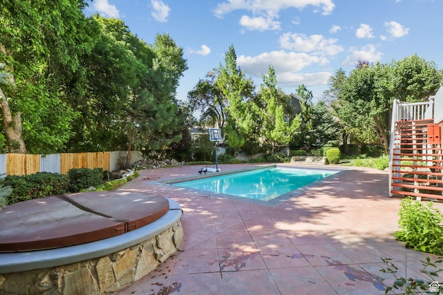 9618 S Ruskin Cir E, Sandy, UT 84092 - view of pool featuring a covered hot tub, stairs, and a patio