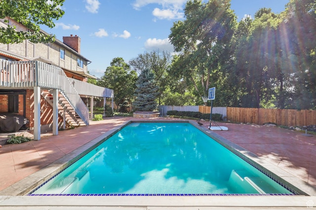 9618 S Ruskin Cir E, Sandy, UT 84092 - view of swimming pool with stairs, a patio area, a fenced backyard, and a wooden deck