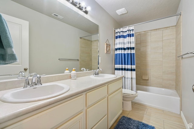598 W Sandhill Dr, Lehi, UT 84043 - bathroom featuring double vanity, shower / tub combo, tile patterned flooring, and a textured ceiling