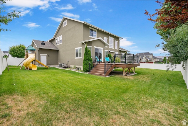 598 W Sandhill Dr, Lehi, UT 84043 - rear view of house featuring a fenced backyard, a playground, a wooden deck, stucco siding, and stairway