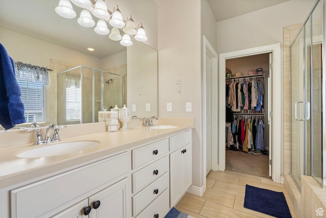 598 W Sandhill Dr, Lehi, UT 84043 - full bathroom featuring a shower stall, a walk in closet, and double vanity
