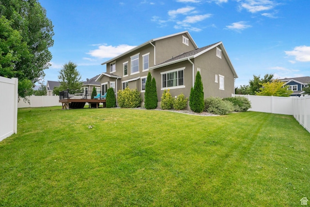 598 W Sandhill Dr, Lehi, UT 84043 - back of house featuring a deck, a fenced backyard, and stucco siding