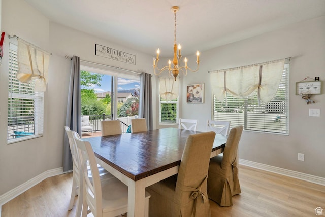 598 W Sandhill Dr, Lehi, UT 84043 - dining area featuring a chandelier and light wood finished floors